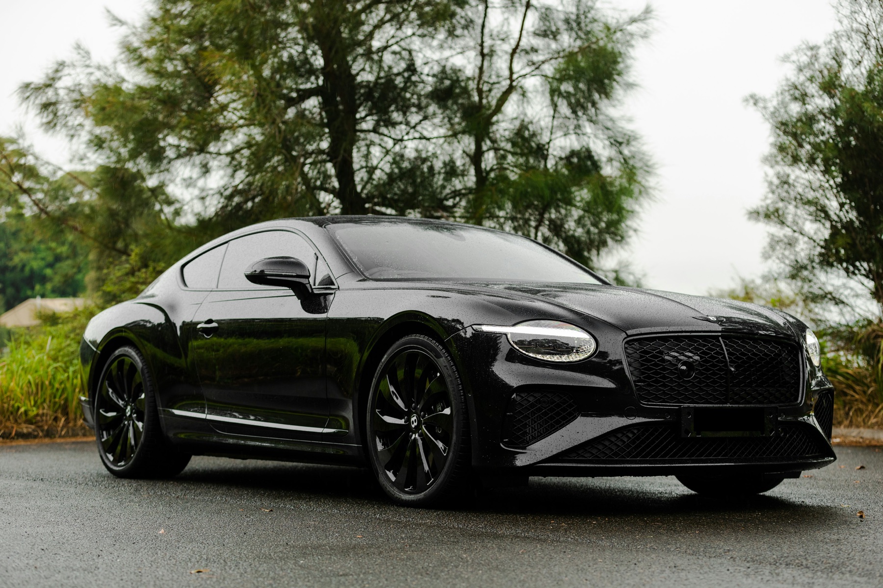 Black Bentley Continental GT from the front three-quarter view